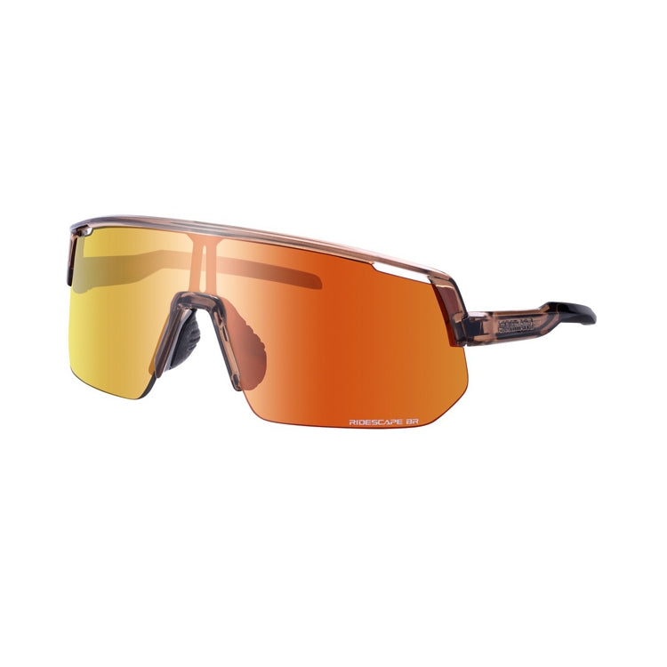 Three-quarter front view of Shimano performance cycling sunglasses with an oversized frameless shield lens in a mirrored orange-gold finish. The translucent brown frame, adjustable nose pads, and streamlined temple arm are visible against a light gray background.