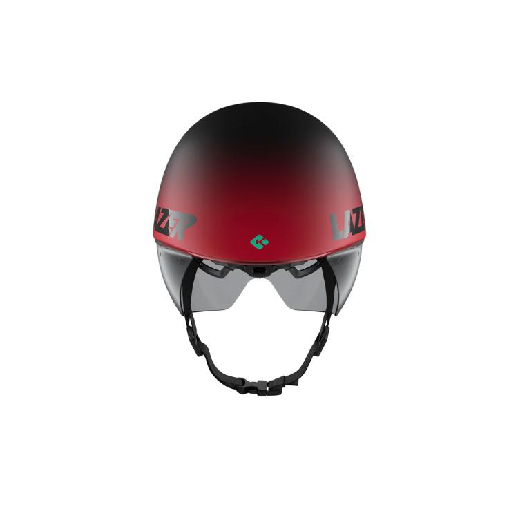 Back view of an aerodynamic cycling time-trial helmet with a matte black-to-red gradient finish. The helmet has an elongated teardrop-shaped rear profile, an integrated tinted visor, and a black chin strap with buckle. Shown against a light gray background.