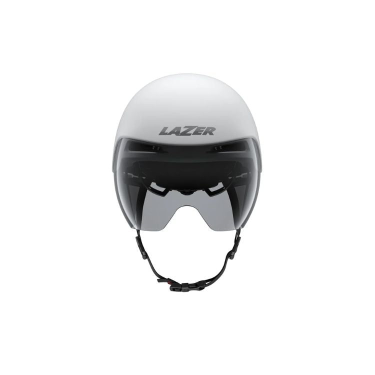 Front view of an aerodynamic cycling time-trial helmet in a matte white and silver finish. The helmet features an extended teardrop-shaped rear profile, an integrated tinted visor covering the eye area, and an adjustable black chin strap. The brand name “LAZER” appears in large silver lettering on the front. Shown against a light gray background.