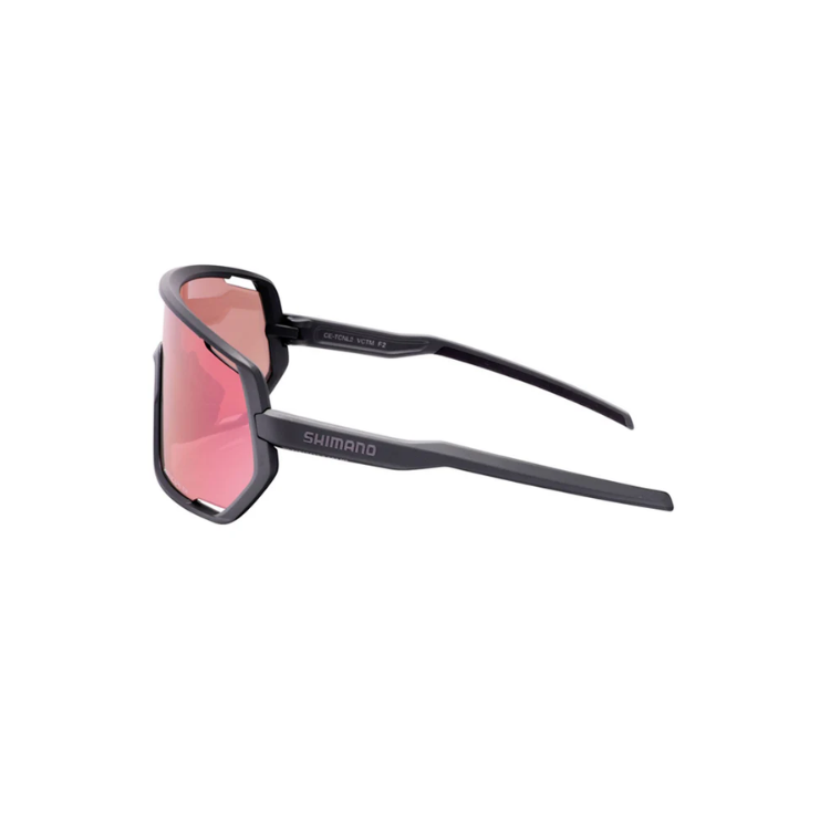 Shimano Technium eyewear with pink reflective lenses and matte black frame with ridescape tr and Shimano wording, left view
