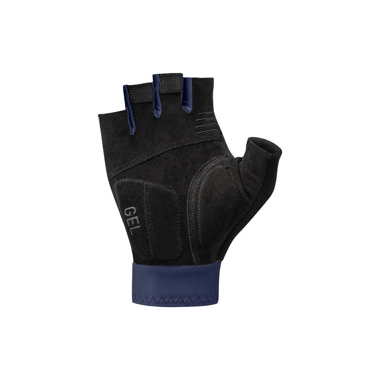 Fingerless cycling glove shown from the palm side, featuring a black synthetic suede palm with gel padding on the heel and thumb areas for comfort and shock absorption. The glove includes perforated ventilation holes, textured finger pull tabs with navy accents, a navy cuff, and the word “GEL” printed near the wrist. Displayed against a light gray background.