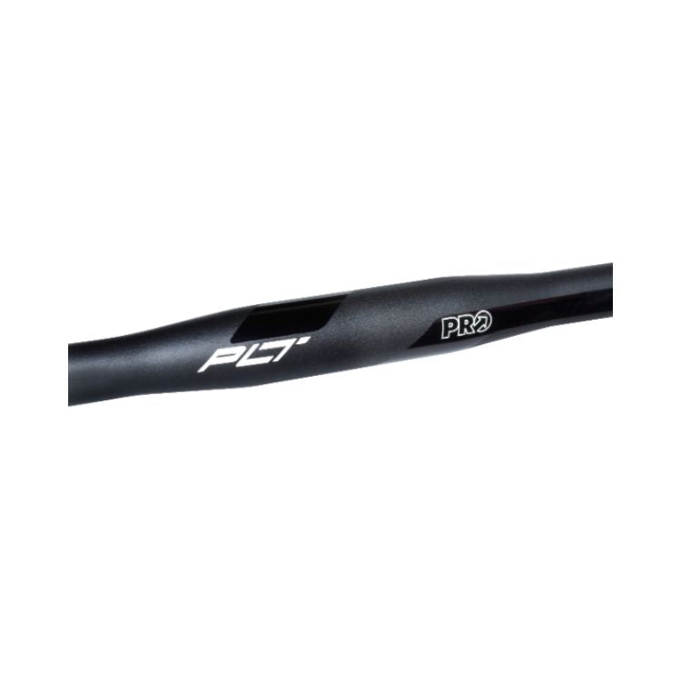 Close-up detail of a black PRO PLT road bicycle handlebar on a light gray background. The image focuses on the slightly flattened top section of the handlebar, showing white "PLT" and "PRO" branding against the matte black finish, with subtle ergonomic shaping visible along the bar.