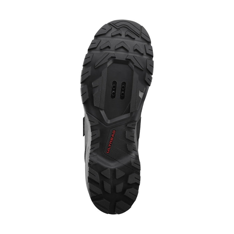 Close up of black rubber sole, 'Ultread' branding, bottom view
