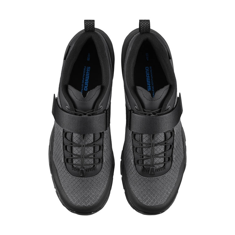 A pair of black shoes with a strap, top view
