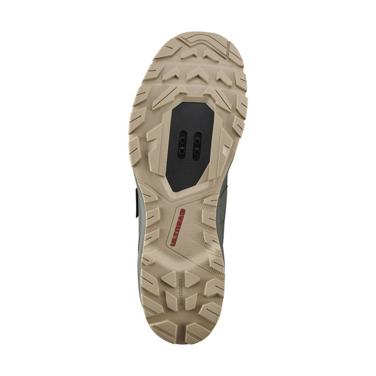 Close up of light brown rubber sole, SPD, 'Ultread' branding, bottom view