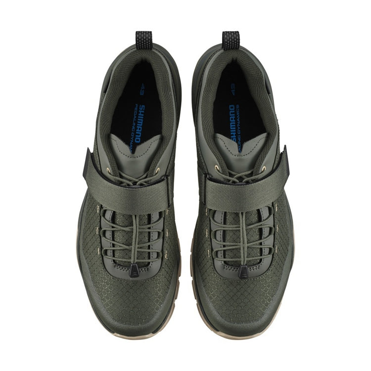 A pair of olive shoe with strap, top view