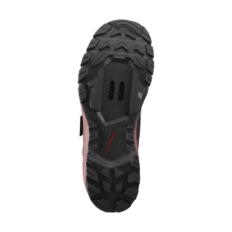 Close up of black rubber sole, SPD, 'Ultread' branding, bottom view