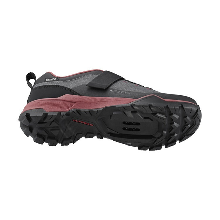  Black and red shoe with red and black sole, black straps, 'Ultread' branding, bottom view