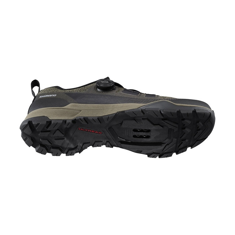 Olive shoe with one black BOA dial, Shimano logo, green and black rubber sole, 'Ultread' branding, bottom view