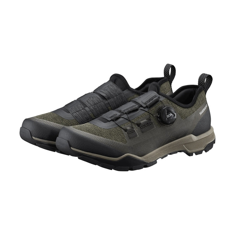 A pair of olive shoe with black BOA dial, Shimano logo, green and black rubber sole, left view
