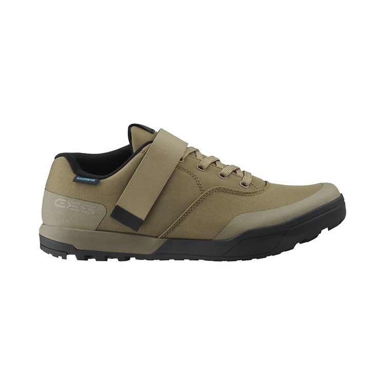 Sand beige cycling shoe with strap and lace, black and earth coloured rubber sole, right view
