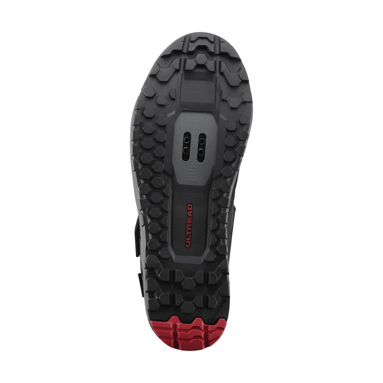 Close up of black and red rubber sole, SPD, 'Ultread' branding, bottom view