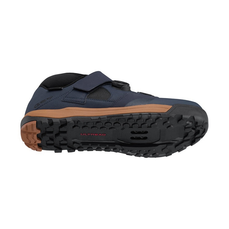 Midnight navy shoe with tan and black sole, one black BOA dial and navy strap,  'Ultread' branding on rubber sole, bottom view
