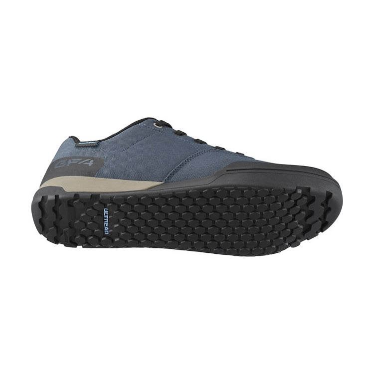 Dark blue shoes with black laces, black sole, 'Ultread' branding on sole, bottom view