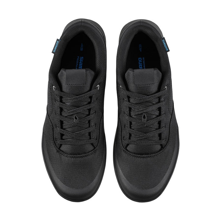 A pair of black shoes with black laces, top view