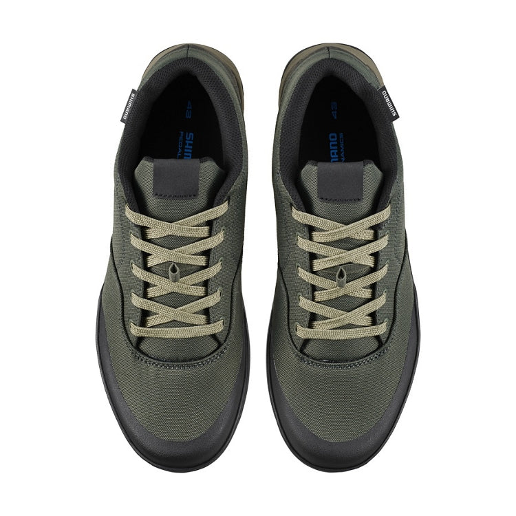 A pair of green shoes with laces, top view