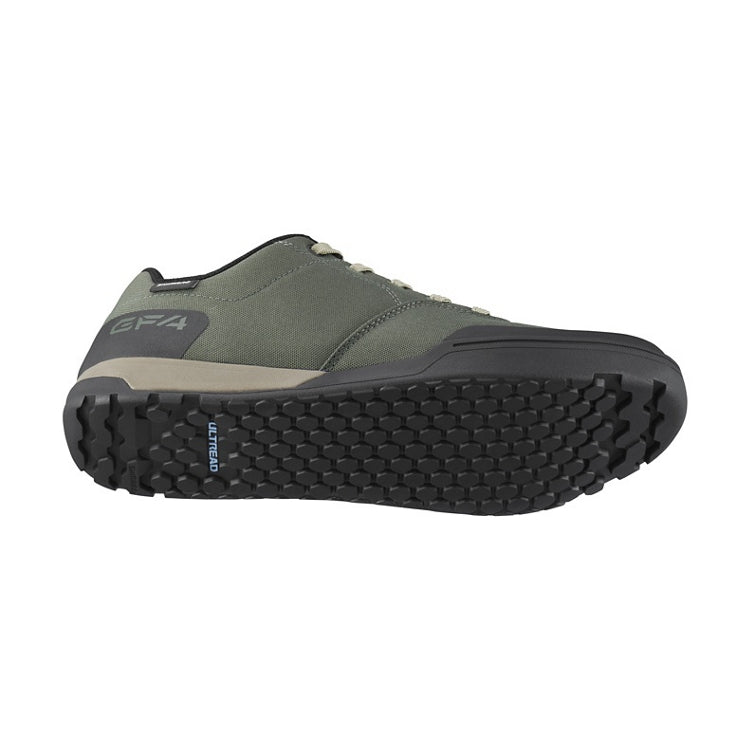 Green shoes with laces, black sole, bottom view