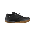Black shoes with black laces, tan sole, right view