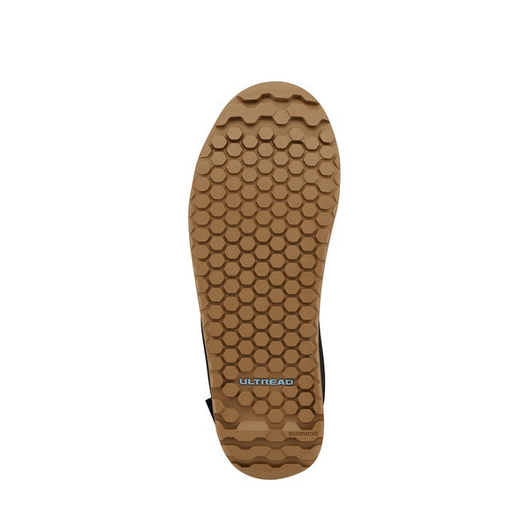 Close up of tan rubber sole with 'ULTREAD' branding 