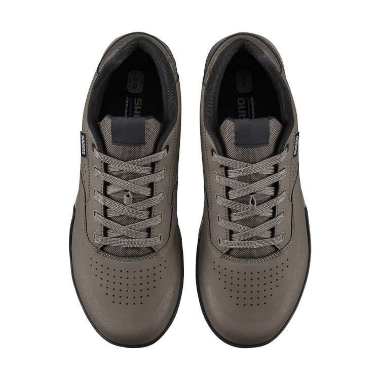 A pair of brown shoes with laces, top view