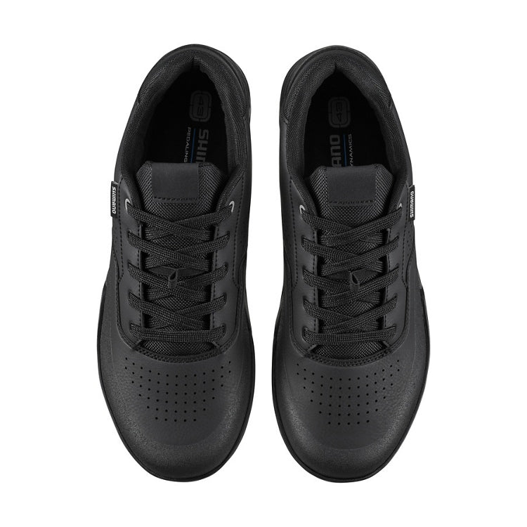 A pair of black shoes with laces, top view