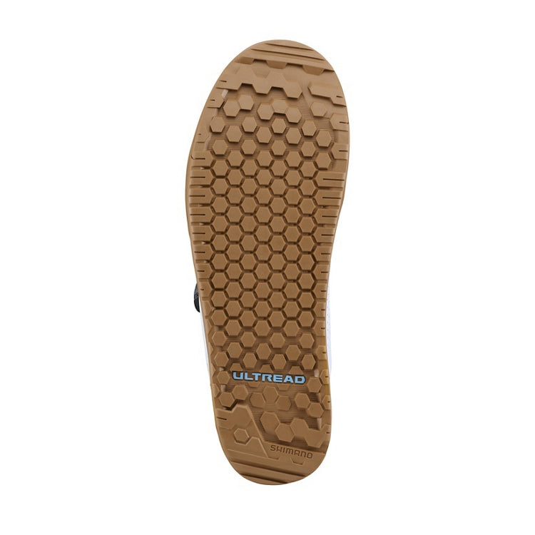 Close-up of a tan shoe sole with 'Ultread' branding 