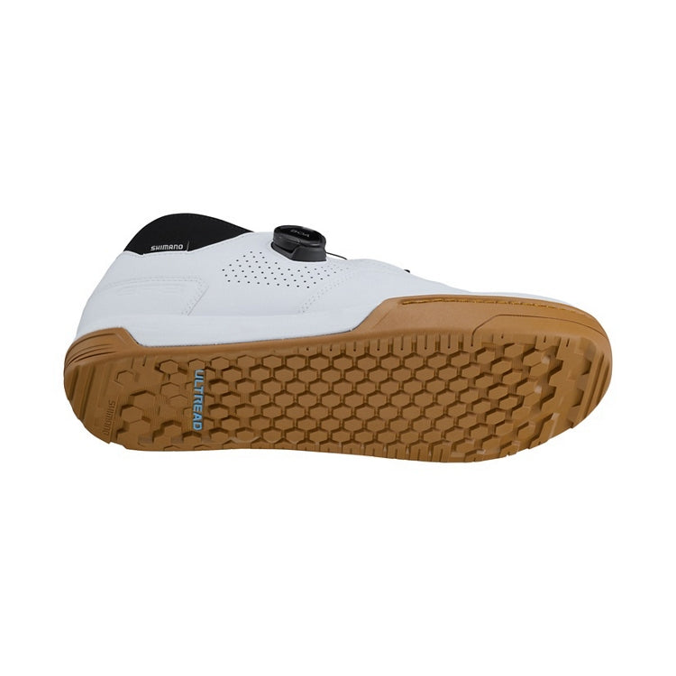 Black cycling shoe with tan 'Ultread' rubber sole and black BOA dial, bottom view