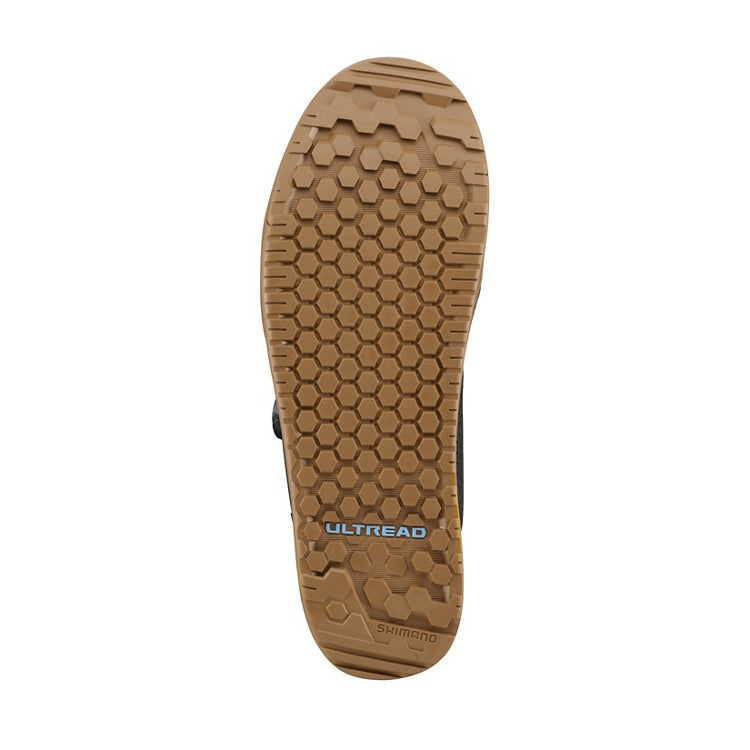 Close-up of a tan rubber shoe sole with 'Ultread' branding