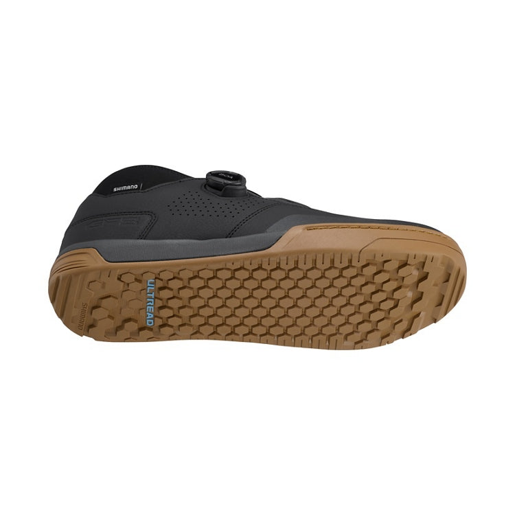 Black cycling shoe with tan ultread rubber sole and black BOA dial, bottom view