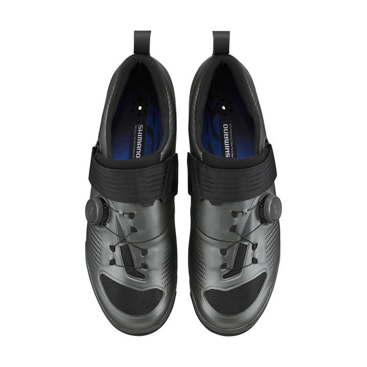A pair of Shimano black cycling shoe with black strap and black BOA dial, top view