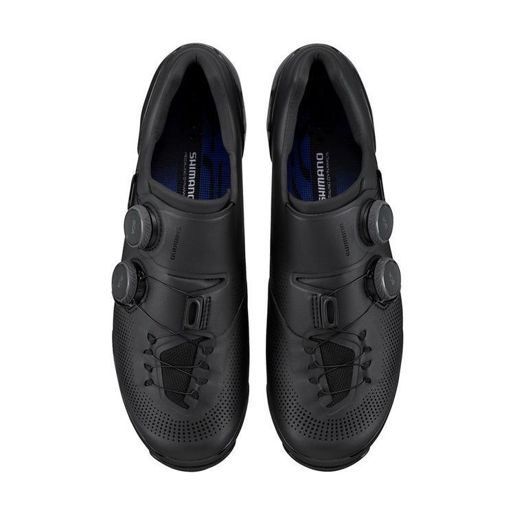 Pair of black Shimano cycling shoes with 2 black BOA dials on each side with Shimano logo, top view