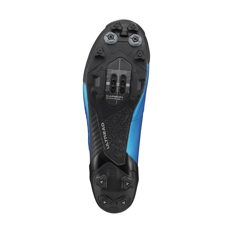Close-up of a black and blue cleat sole with ultread rubber, bottom view