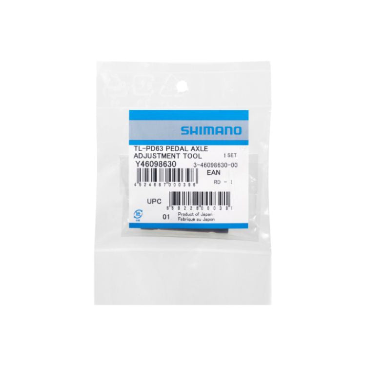 Shimano TL-PD63 Pedal Axle Adjustment Tool packaged in a clear plastic bag with a product identification label, shown against a light gray background.