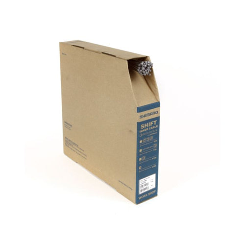 Shimano workshop shift inner cable bulk dispenser box in brown cardboard packaging, featuring blue product identification panels and multiple stainless steel shift cable ends protruding from the top dispensing slot, shown against a light gray background.