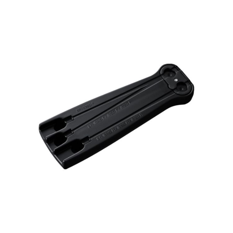 Black plastic bicycle wheel spacer tool with three parallel channels and circular cutouts, designed for wheel transport or protection, shown against a light gray background.